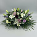 fresh flower 2-3 ft funeral spray with white lilies, lilac roses, various toned purple carnations and green foliage by jamesia blooms