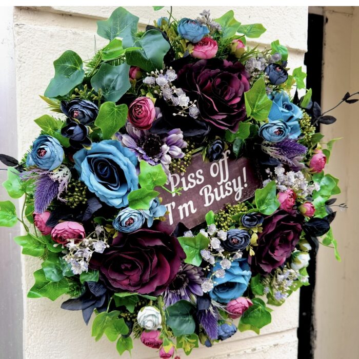 Cranky Karen wreath from the Jamesia Blooms Karen Collection with "piss off I'm busy sign" deep blue and burgundy artificial florals, funny grumpy door decor